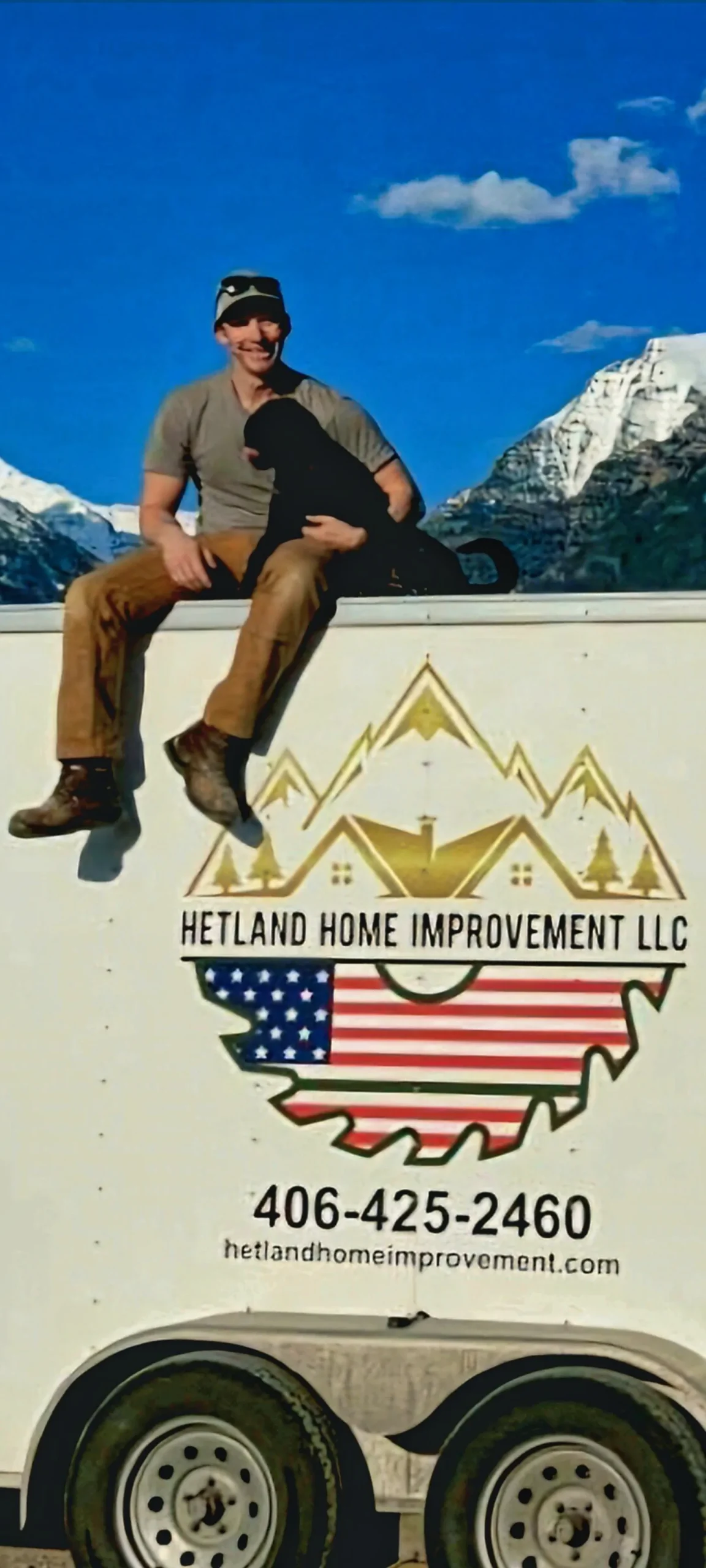 Hetland Home Improvement business trailer with the Montana mountains in the background.