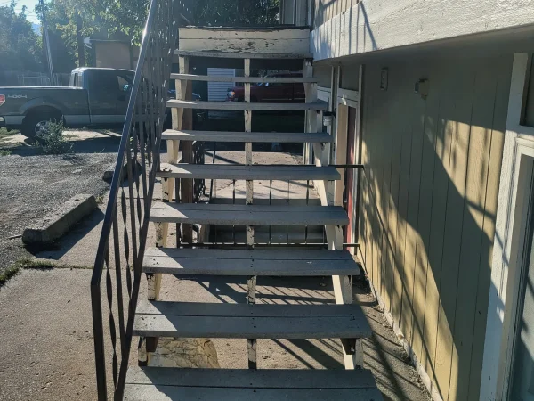 Apartment exterior stairs before structural rebuild in Missoula.