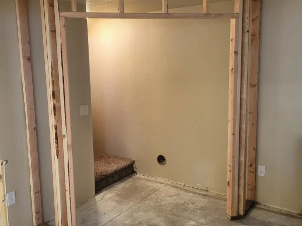 Framing of a new partition wall for French doors in a Missoula basement remodel.