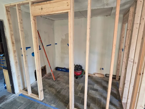 Stud framing for new bathroom walls in a Missoula remodel project.
