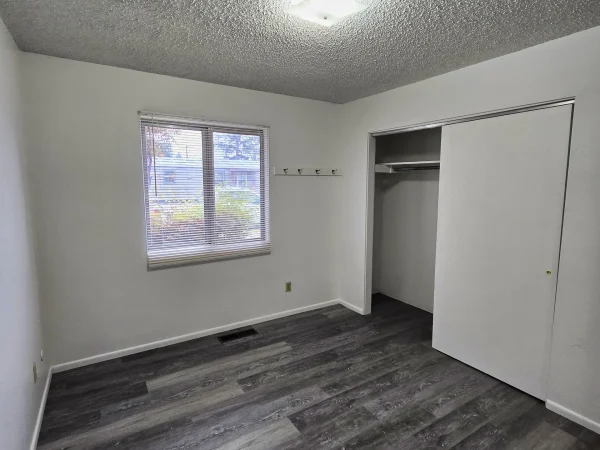 New LVP flooring and fresh interior paint in a Missoula bedroom.