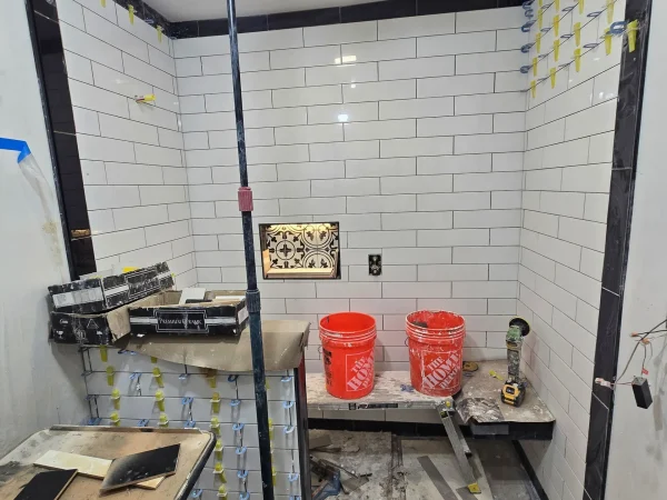 Completed subway tile shower with an integrated LED niche in Missoula.