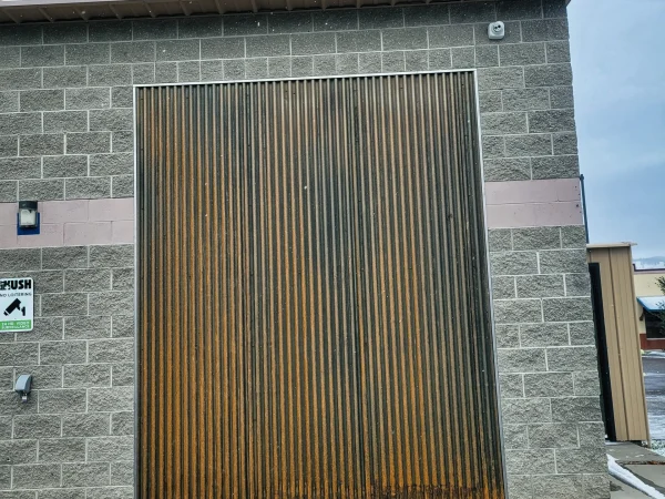 Close-up of custom rusted corrugated metal panel for a Missoula commercial building.