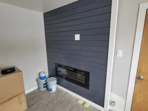 Custom shiplap fireplace and media center installation in Missoula.