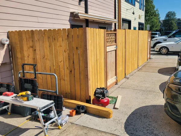 Custom wood gate with lattice top for Missoula veterinary clinic fence.