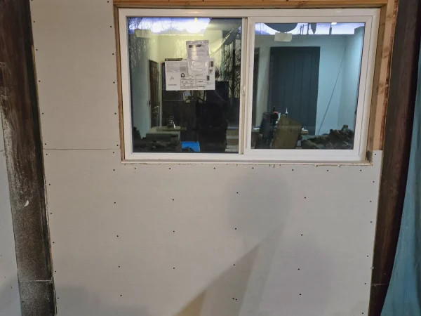 New sheetrock installed around a window in Missoula.