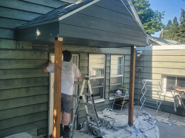 Finished gable porch roof addition painted to match house in Missoula.