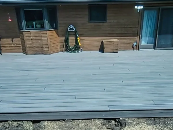 Finished 16x40 light-gray composite deck with picture-frame border in Missoula.