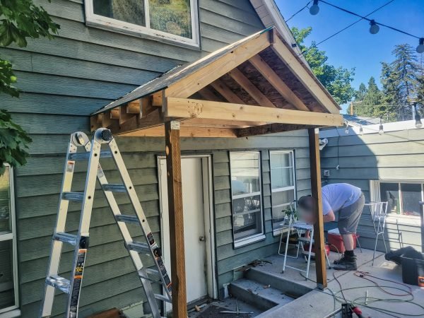 Gable porch roof framing with rafters and ridge board in Missoula.