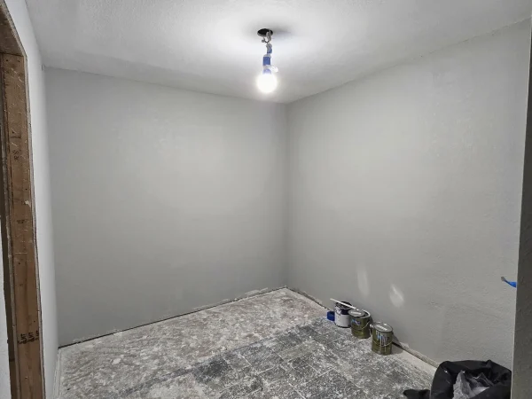 Finished hallway with a clean finish coat and professional drywall.