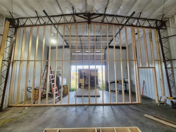 Interior demising wall framing for a metal shop in Missoula.