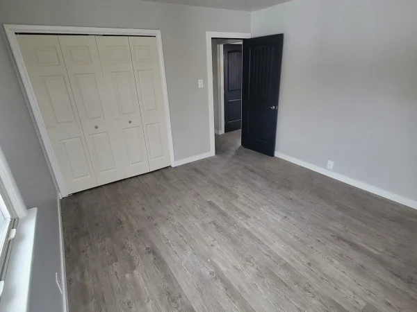 Modern interior door and LVP flooring installation in Missoula.