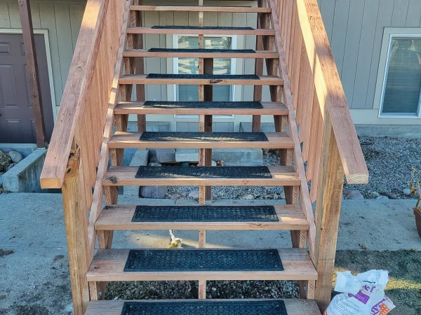 New exterior wood stairs with rubber safety mats in Missoula.