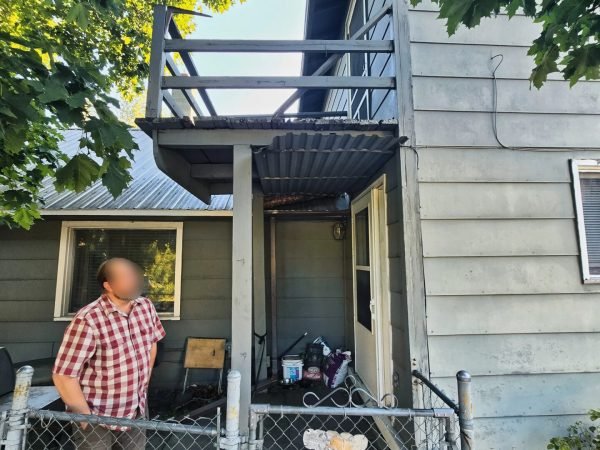 Original weathered grey balcony before being demo'd and rebuilt.