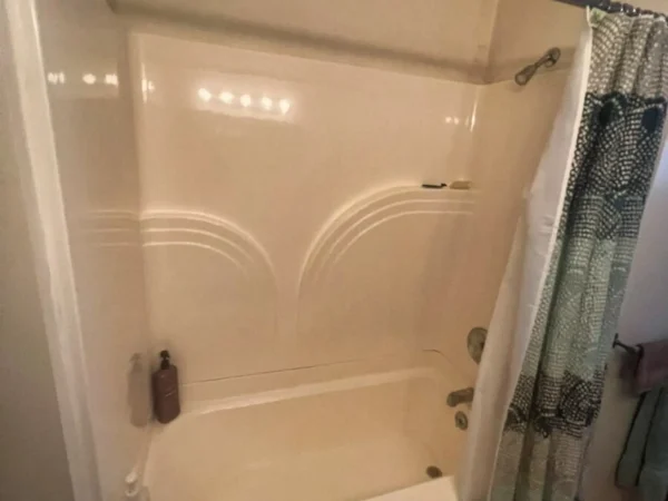 Original alcove bathtub and dated surround before Missoula remodel.