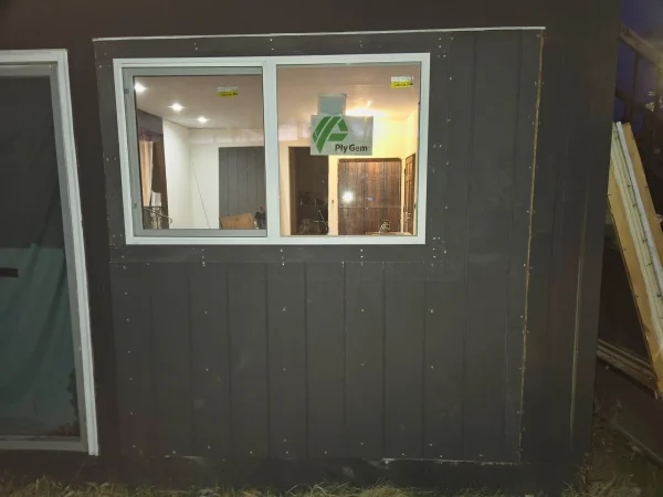 New Ply Gem window installed with dark T1-11 siding for a security upgrade in Missoula.