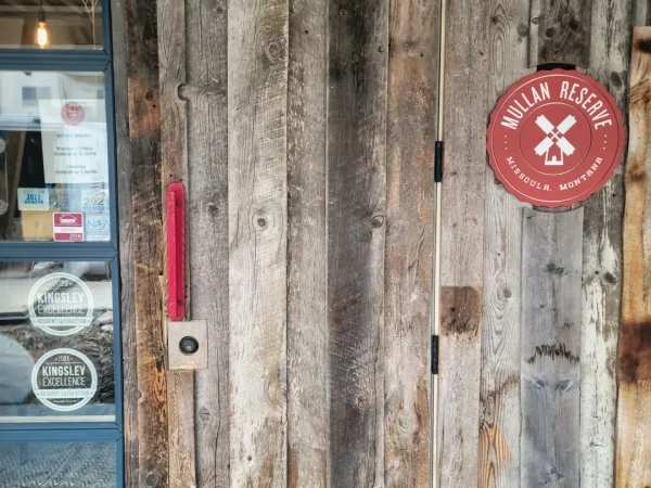 Reclaimed wood exterior door after structural jamb repair in Missoula.
