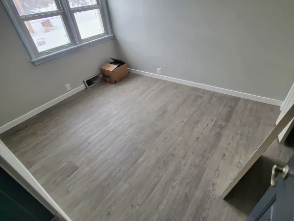 Residential interior remodel featuring LVP flooring and fresh paint in Missoula.