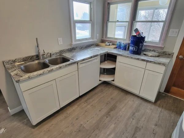 Salvaged stainless steel sink reinstalled in new White Sugar cabinets in Missoula.